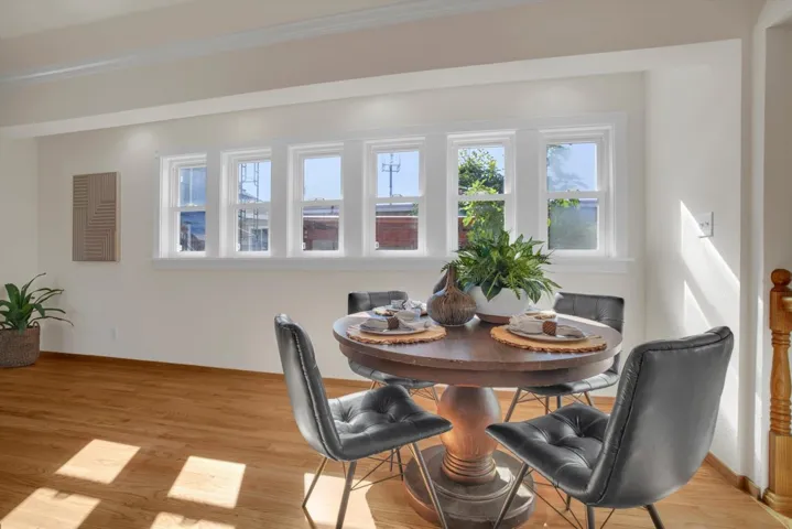 Dining area with wood finished floors and baseboards