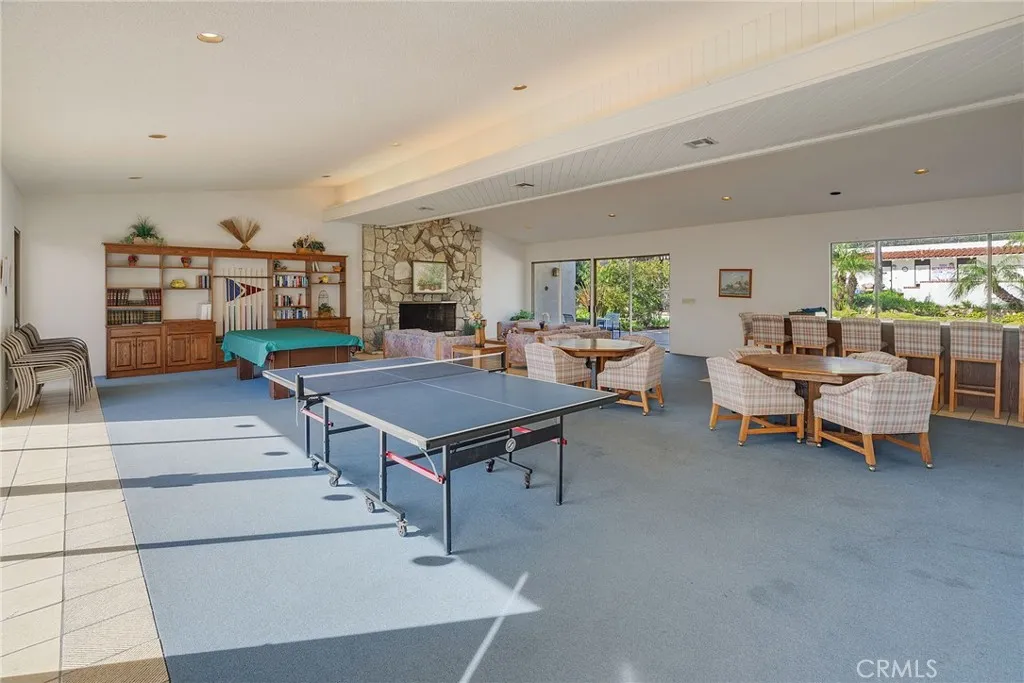 Community Room and Bar Area and Pool and Table Tennis. Beautiful Cozy Fireplace too.