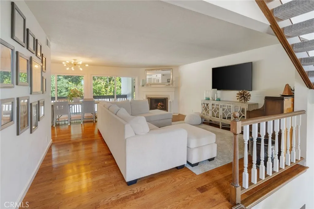 Main Living Space is On Level Two and Features Hardwood Flooring and Fabulous Light from Large Windows and Outside Access on both sides.