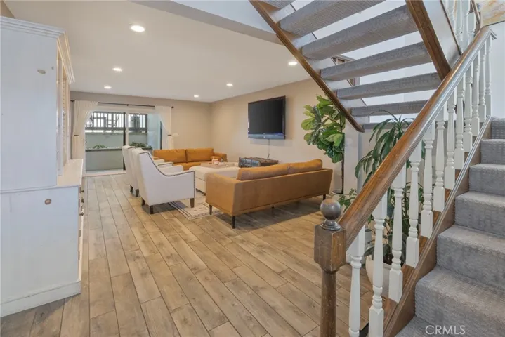 First Floor Family Room with Wet Bar, Guest Bath and outside access.
