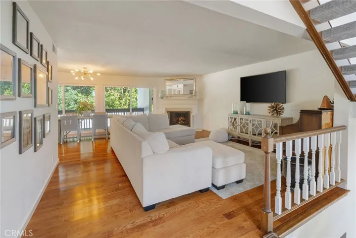 Main Living Space is On Level Two and Features Hardwood Flooring and Fabulous Light from Large Windows and Outside Access on both sides.
