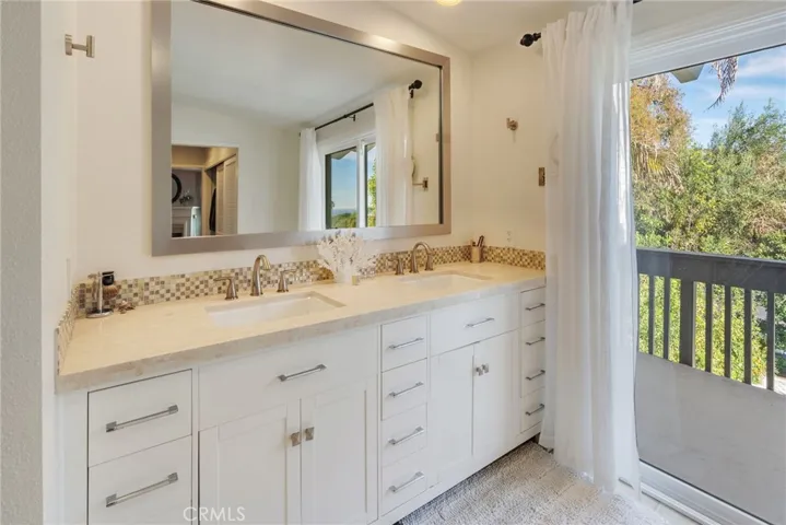 Primary Bathroom with Beautiful Light and Access to View Balcony