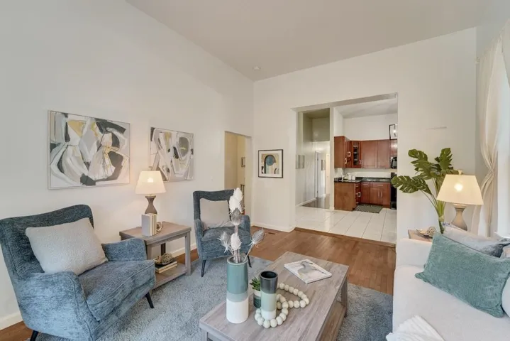 Living area with light wood-type flooring and baseboards