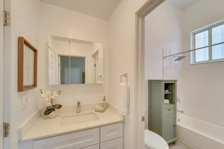 Bathroom with vanity and shower / bathtub combination