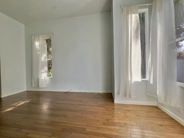 Spare room with hardwood / wood-style flooring