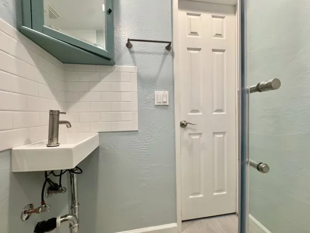 Bathroom featuring a textured wall