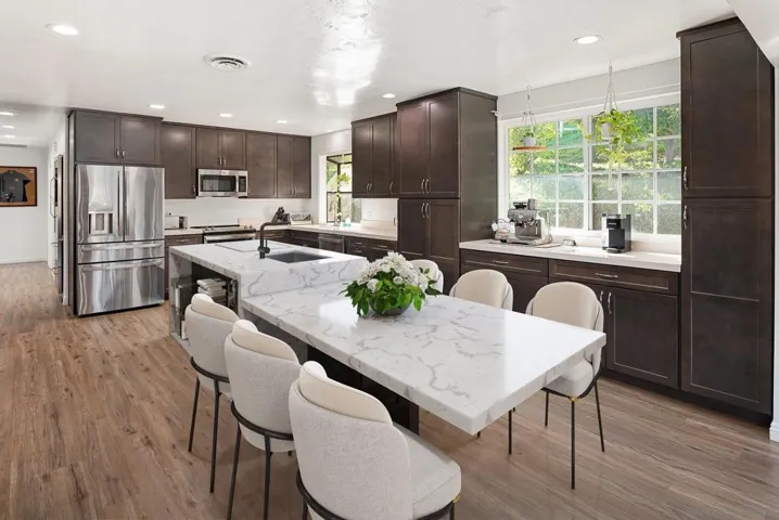 Open kitchen has room for an island and chef's table as illustrated here.
