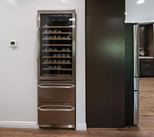 wine fridge just off the side of the refrigerator for the​​‌​​​​‌​​‌‌​​‌​​​‌‌​​​‌​​‌‌​​‌‌​​‌‌​​​​ kitchen