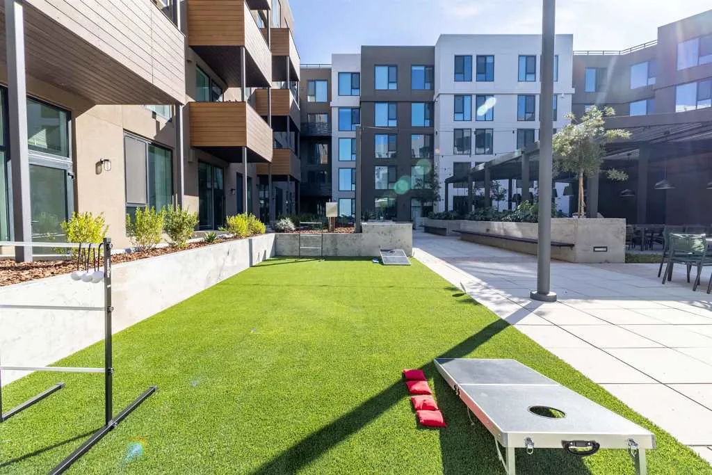 View of community featuring a lawn