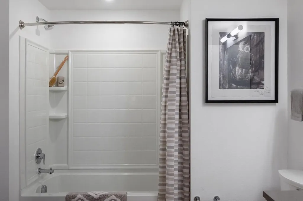 Full bathroom featuring shower / bath combo