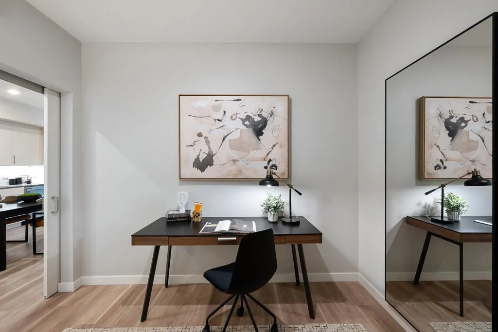 Office space with light wood-style floors and baseboards
