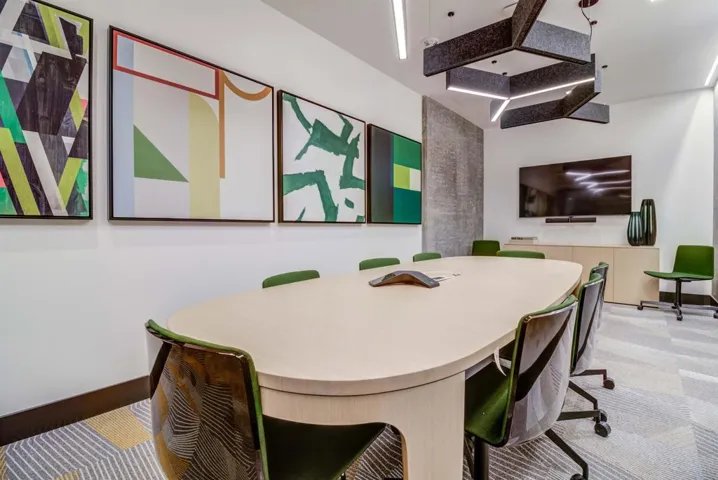 Carpeted dining room featuring baseboards