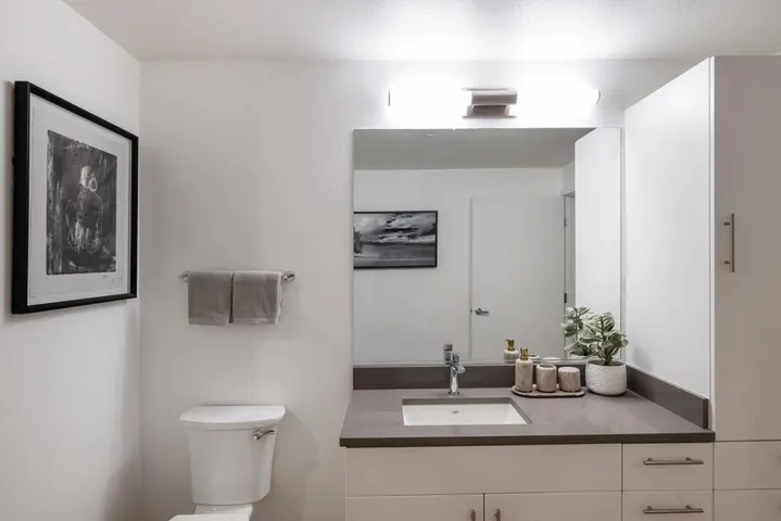 Half bathroom with vanity and toilet