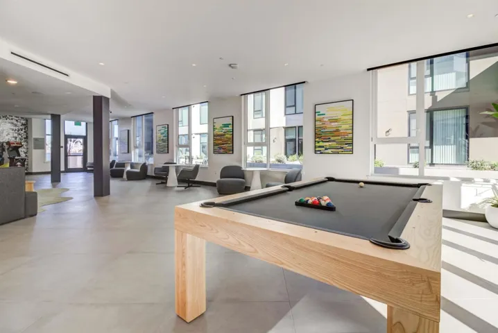 Playroom featuring pool table, healthy amount of natural light, recessed lighting, and light tile patterned flooring