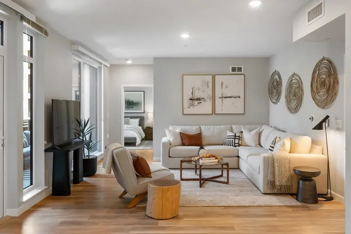 Living area featuring light wood-type flooring and recessed lighting