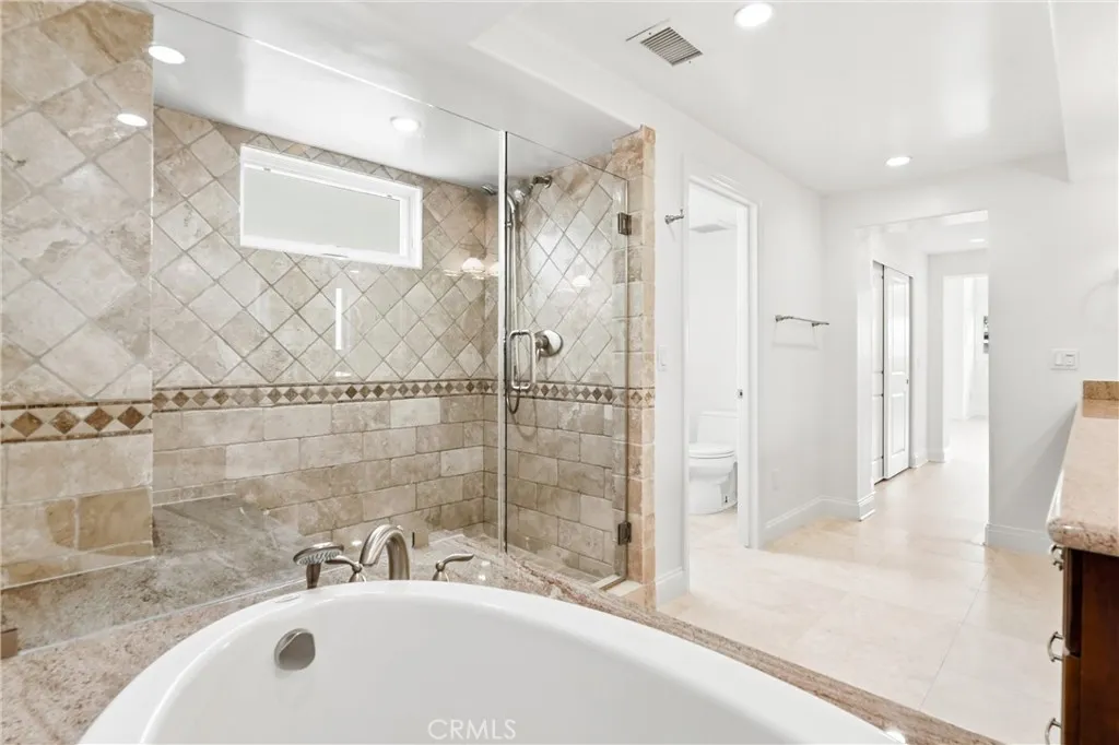 Soaking tub and large frameless shower