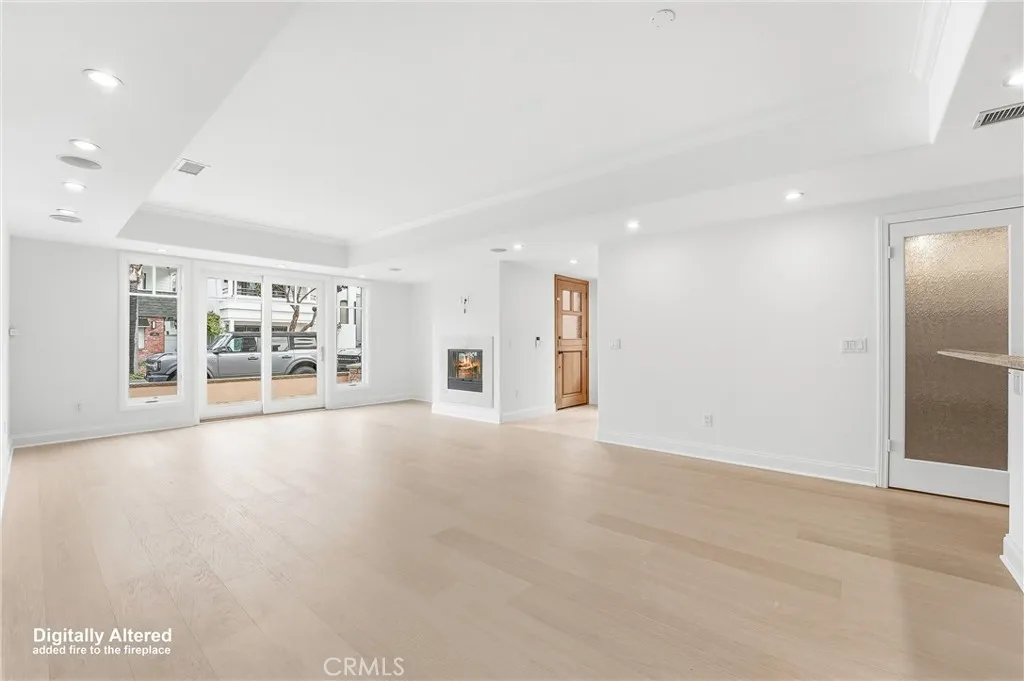 Open Concept living/dining room with front patio in view
