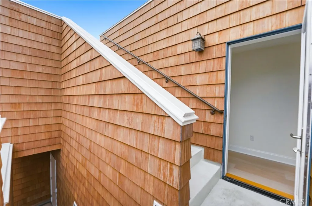Exterior Staircase at second level, up to the roof top, down to ground level or head in to 2nd floor hallway