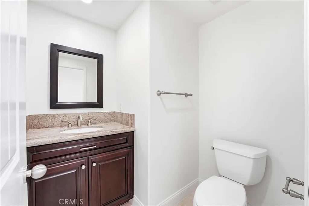 Downstairs Powder Room discretely located