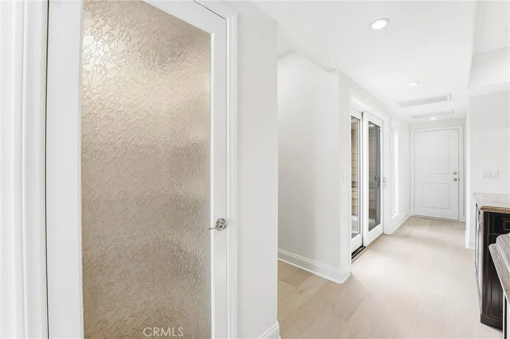 Walk-in Pantry, stairs, off kitchen patio, then out the far door to  the garage