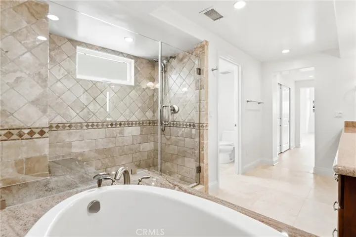 Soaking tub and large frameless shower