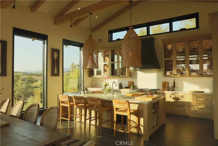 Great Room - Kitchen, Dining + Living overlooking the vineyard