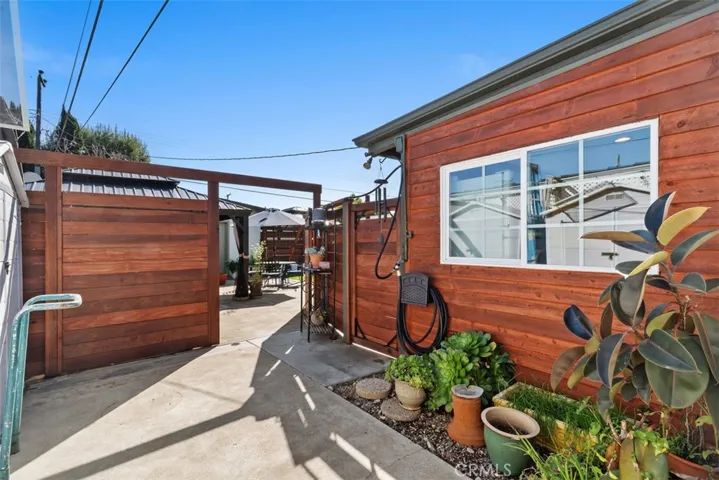 View to the backyard area with a pergola