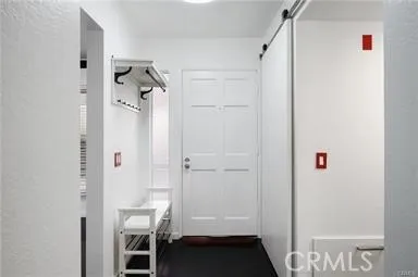 Convenient stackable laundry units discreetly tucked behind sliding door