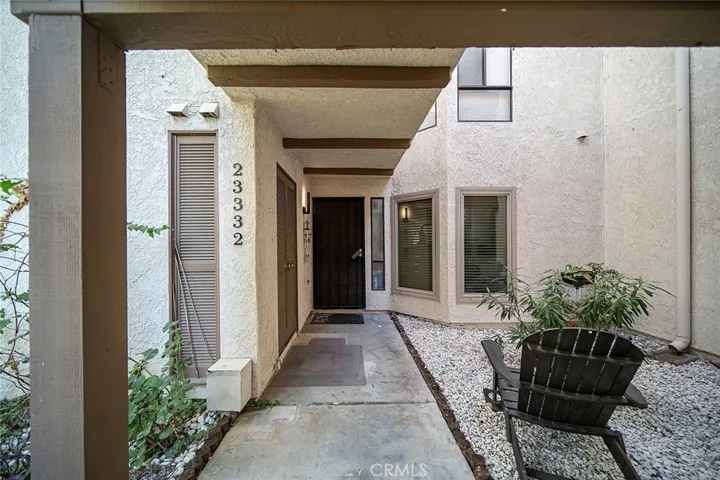 Door #1 Front Charming and private front entry walkway welcoming you home.
