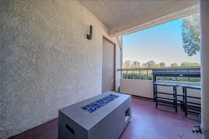 Door #2 Rear Private rear patio with an inviting outdoor fire table.
