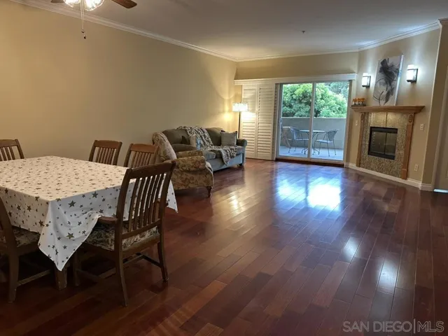 Living Room, dining room to west facing balcony .  Electric fireplace