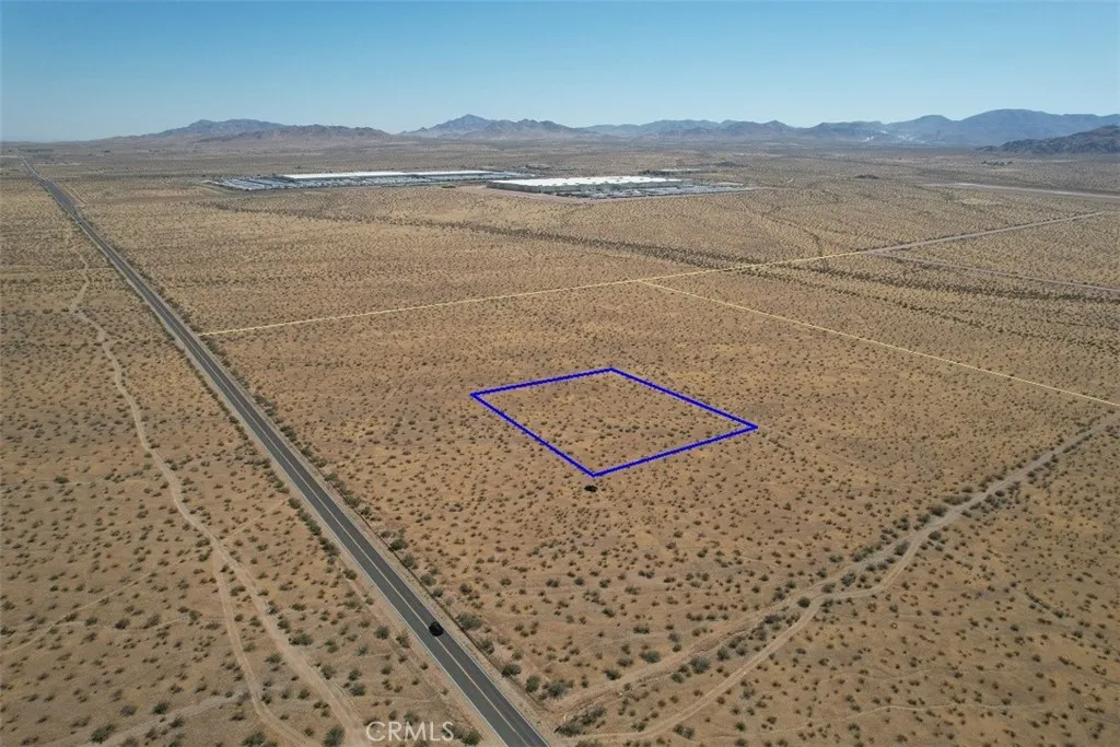 Dale Evans Pkwy to the left of photo - Looking north toward Walmart/former Big Lots Distribution Centers.