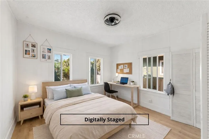 Back bedroom digitally staged.