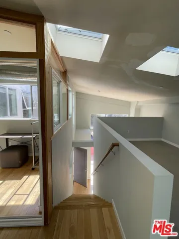 Stairs down with skylights