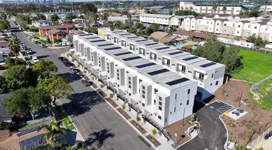 Aerial view highlighting solar panels installed on each home, helping reduce monthly energy costs.