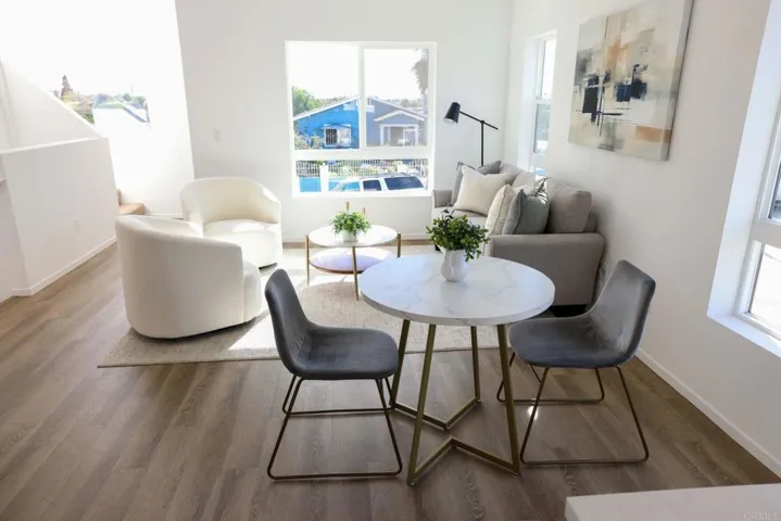 Open-concept living and dining space with abundant natural light and modern finishes.