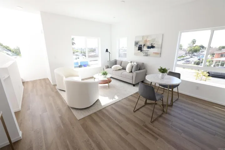 Bright, flexible layout connecting living, dining, and kitchen areas.
