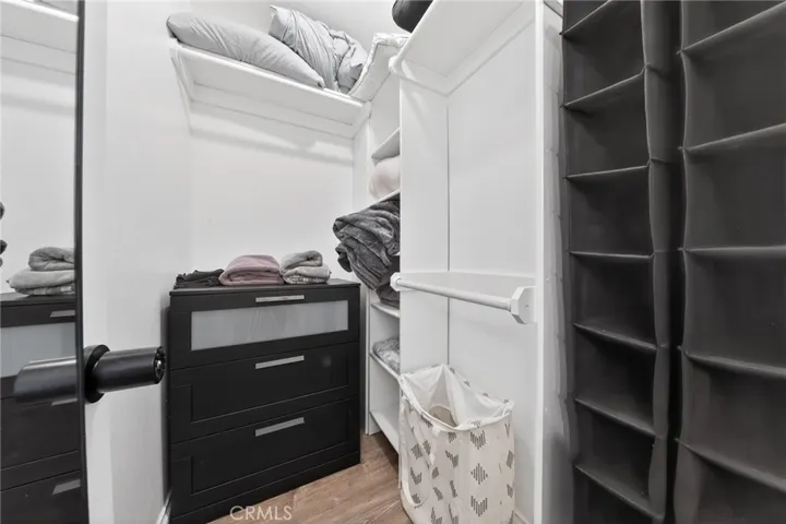 Primary bedroom with walk-in closet, organiser and lots of storage.