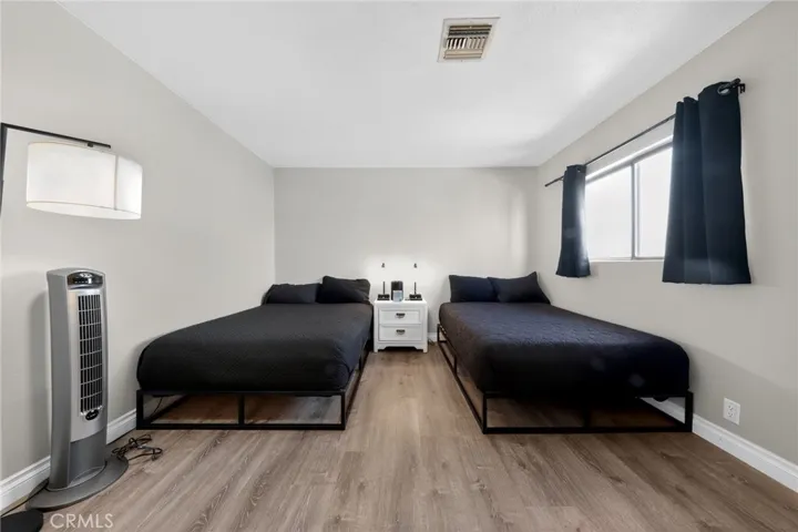 Large secondary bedroom also  has walk  closet  and individual vanity.