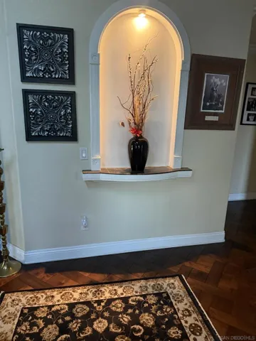 First wall you see as you enter the home.  Notice the built-in niche.