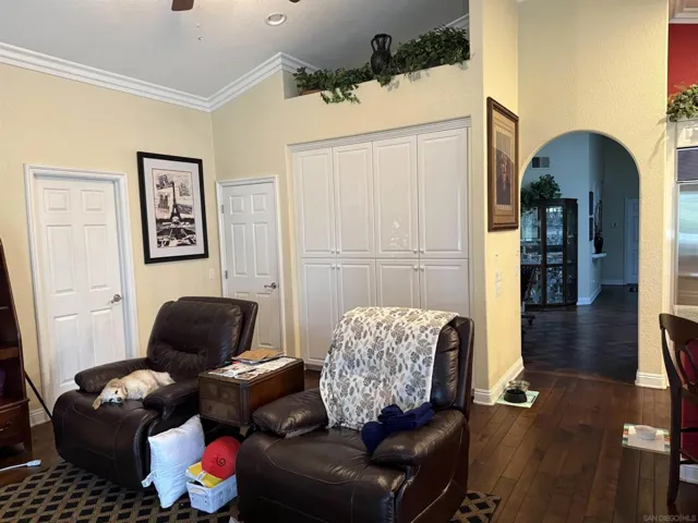 Door leading to bathroom.  Lots of built-in cabinetry and a pantry.  Lots of storage.