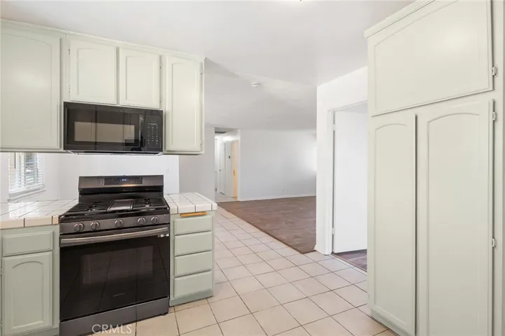 Partial kitchen and living area