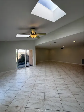 Dining area has two skylights and overlooks backyard