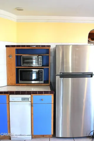 Kitchen counter and refrigerator