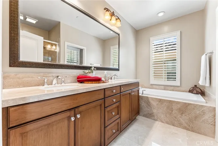 Marble around the tub and on the floor.