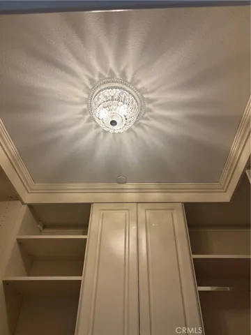 Beautiful light fixture in the primary suite's closet.