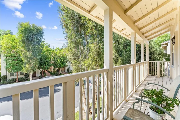 A covered balcony off the primary suite.