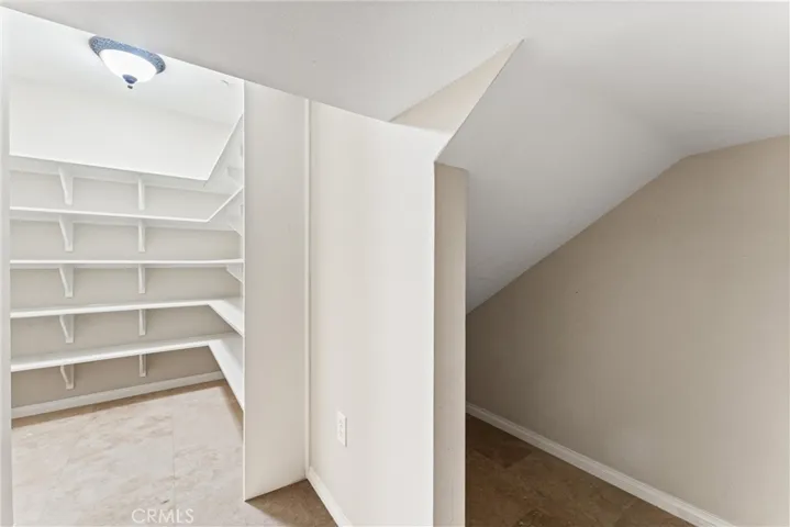A huge storage under the stairs in the walk-in pantry.
