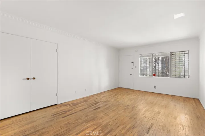 Wood floors with large closets for storage or potential washer/dryer