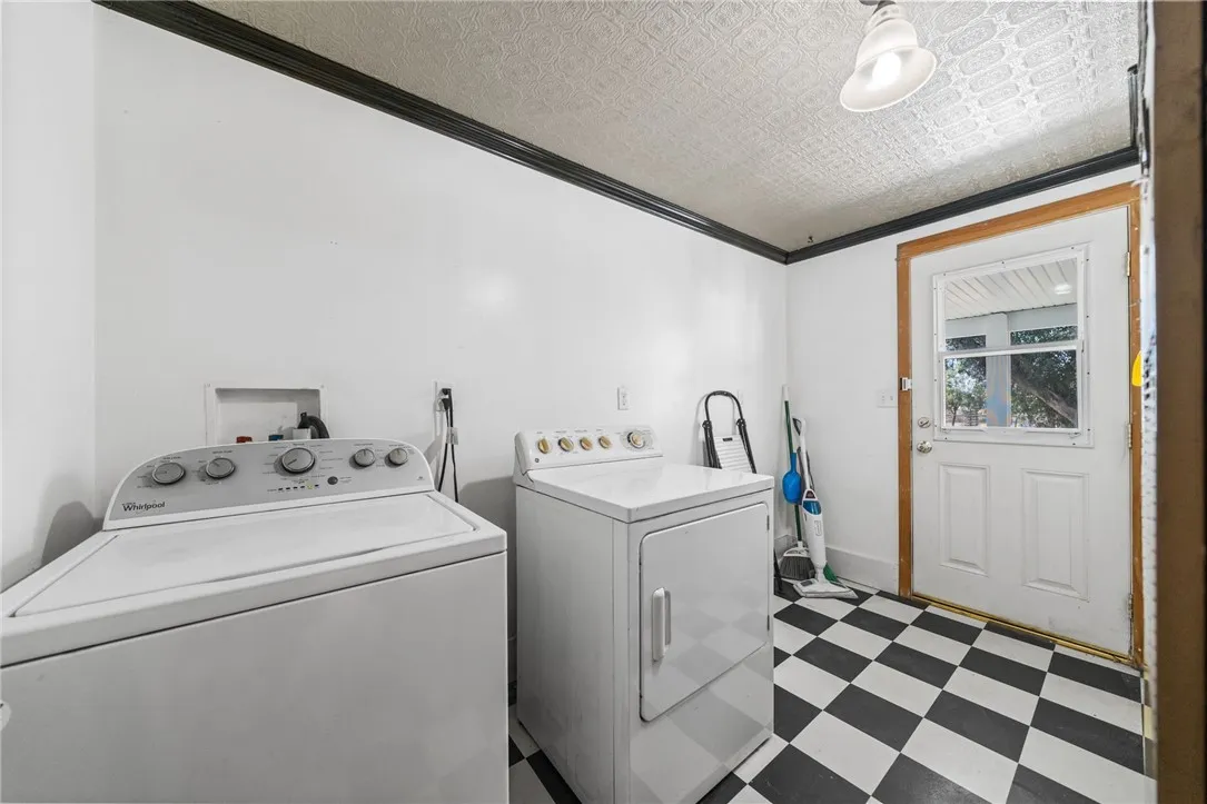 Mudd room with storage area and access to backyard covered patio